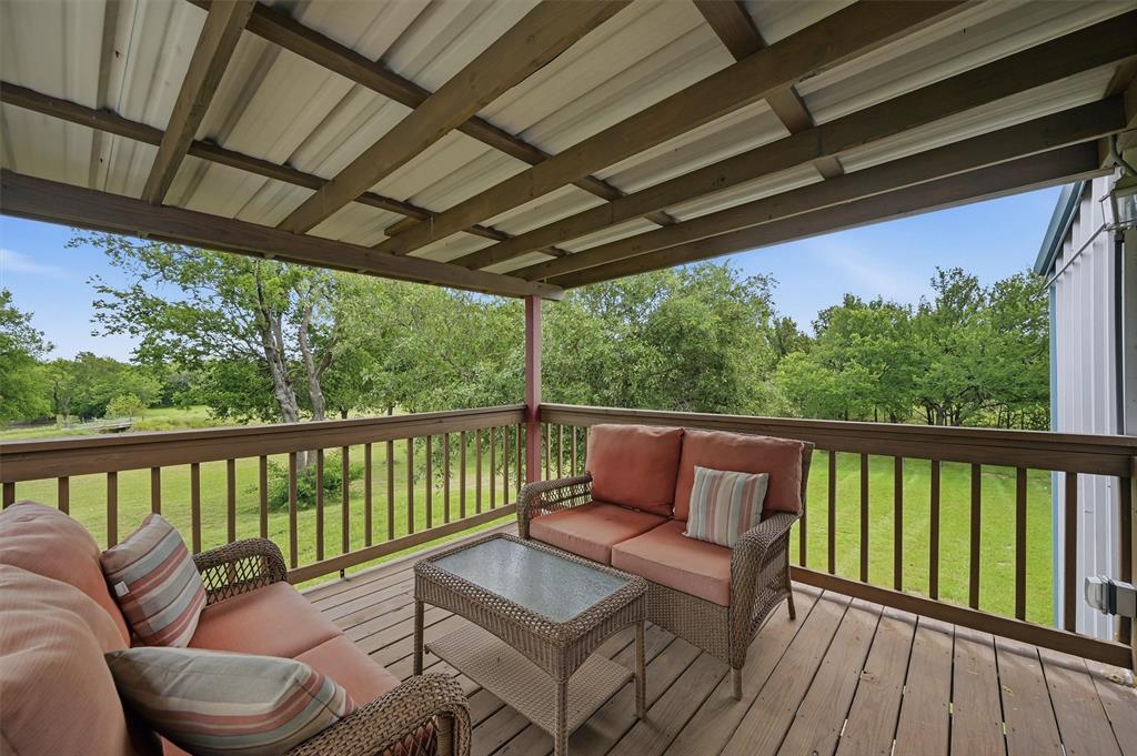 2700 Randell Lake Road Denison, TX 75020 - Photo 16 of 39 a view of a chair in wooden deck