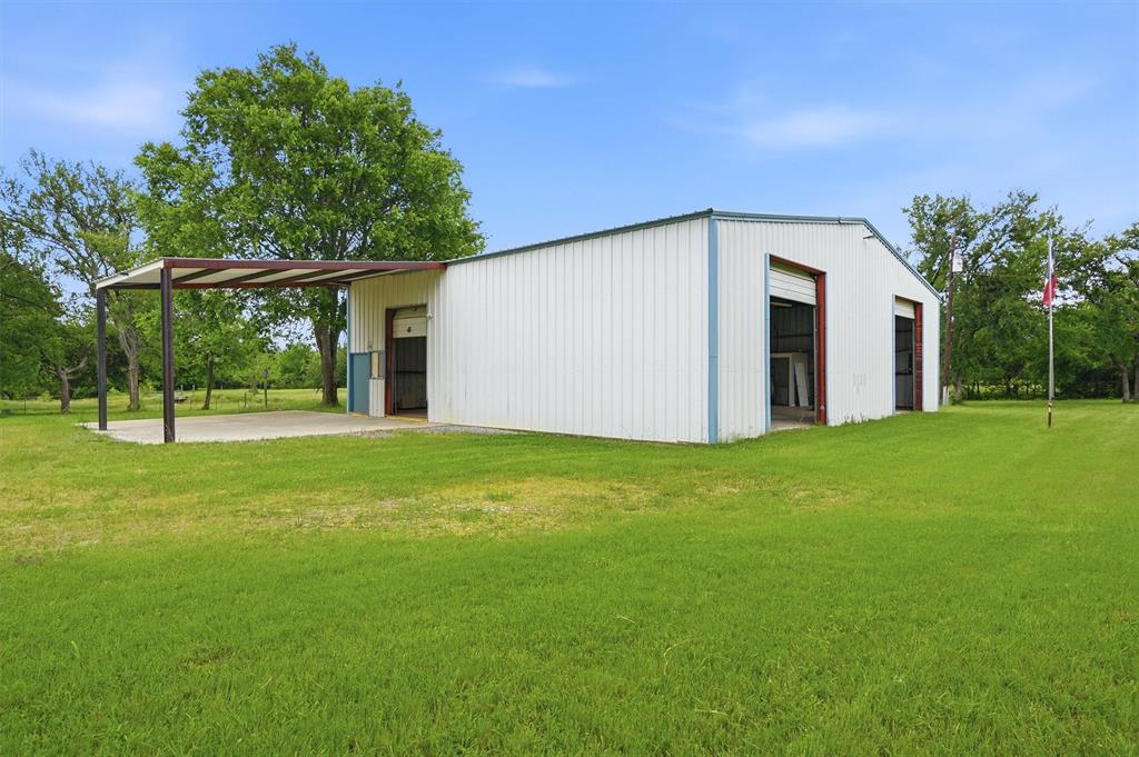 2700 Randell Lake Road Denison, TX 75020 - Photo 6 of 39 a view of a backyard with garden