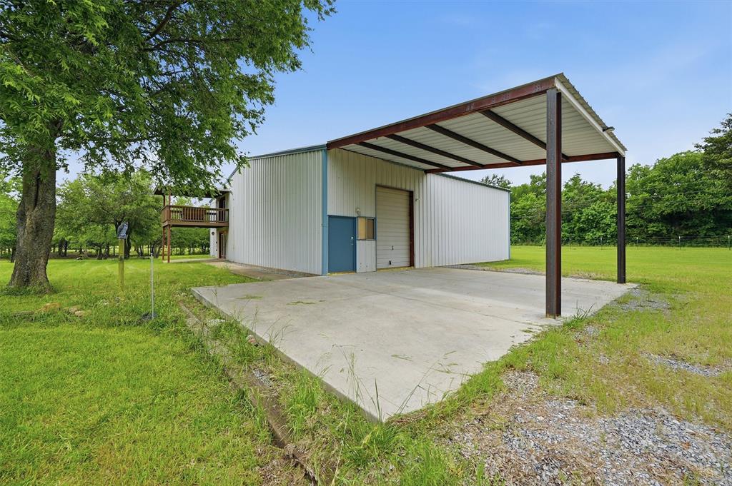 2700 Randell Lake Road Denison, TX 75020 - Photo 8 of 39 a backyard of a house with table and chairs