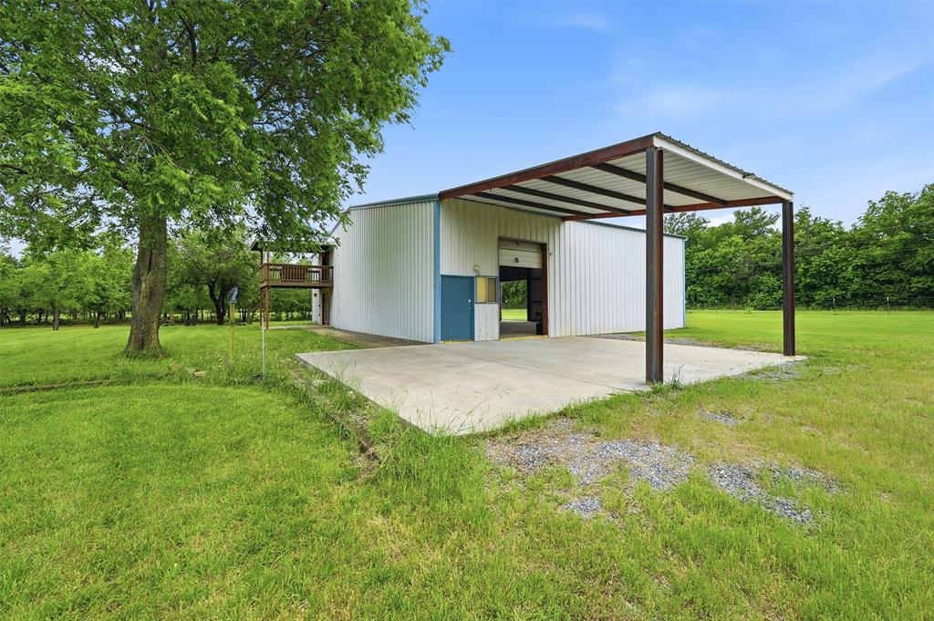 2700 Randell Lake Road Denison, TX 75020 - Photo 9 of 39 a view of a house with a yard and tree