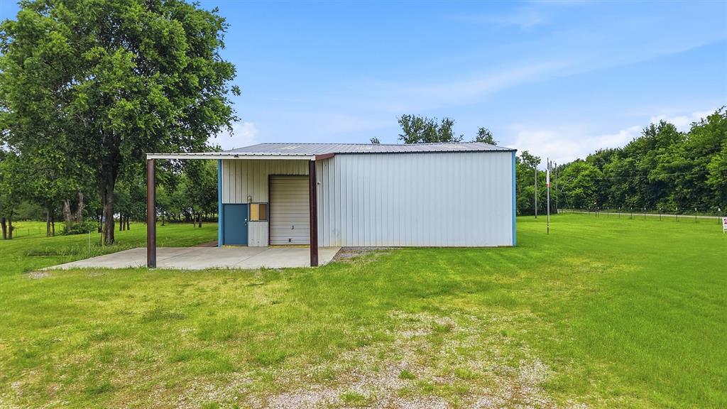 2700 Randell Lake Road Denison, TX 75020 - Photo 10 of 39 a view of a house with a yard and a tree