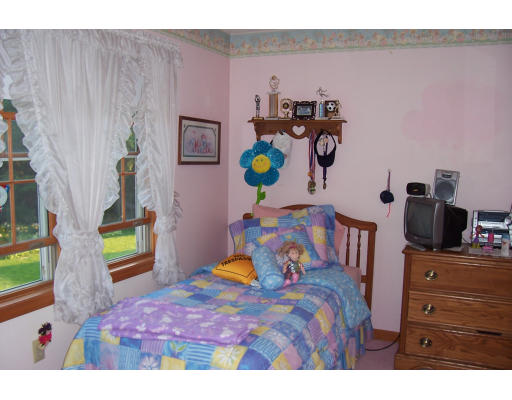 29 Vann Street Springfield, MA 01119 - Photo 11 of 13 a bedroom with a bed and a dresser