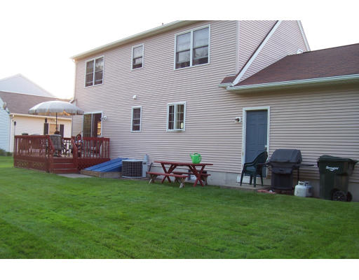 29 Vann Street Springfield, MA 01119 - Photo 3 of 13 a backyard of a house with table and chairs