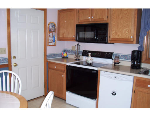 29 Vann Street Springfield, MA 01119 - Photo 7 of 13 a kitchen with stainless steel appliances a stove microwave and sink