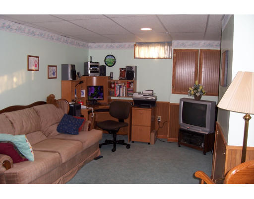 29 Vann Street Springfield, MA 01119 - Photo 8 of 13 a living room with furniture and a flat screen tv