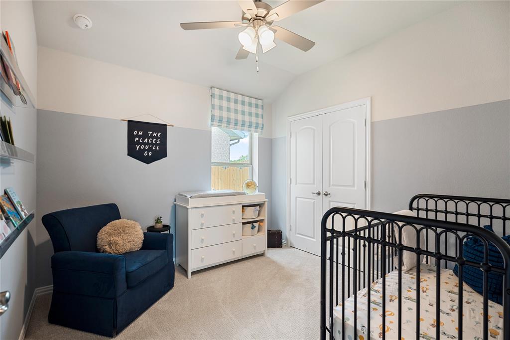 8716 Saratoga Street Pilot Point, TX 76258 - Photo 11 of 16 a bedroom with furniture and a window