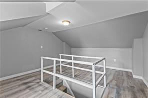 363 44th Street Pittsburgh, PA 15201 - Photo 12 of 14 a view of an empty room with wooden floor and a window