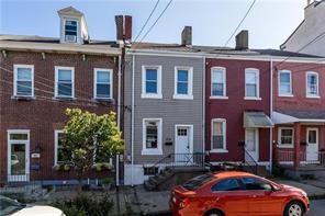 363 44th Street Pittsburgh, PA 15201 - Photo 2 of 14 a front view of a building with car parked