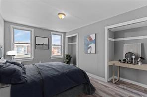 363 44th Street Pittsburgh, PA 15201 - Photo 10 of 14 a bedroom with a bed and a large window