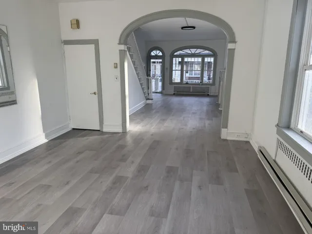 a view of entryway with wooden floor