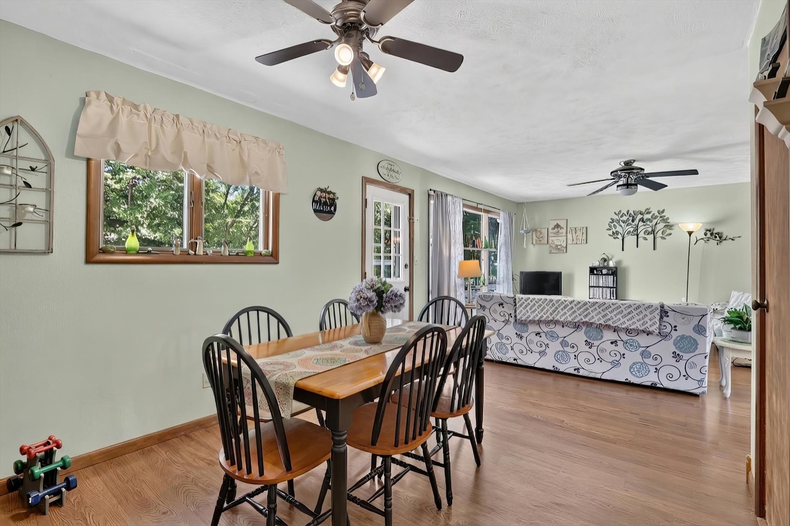 1204 West Violet Street Freeport, IL 61032 - Photo 15 of 36 a view of a dining room with furniture and wooden floor