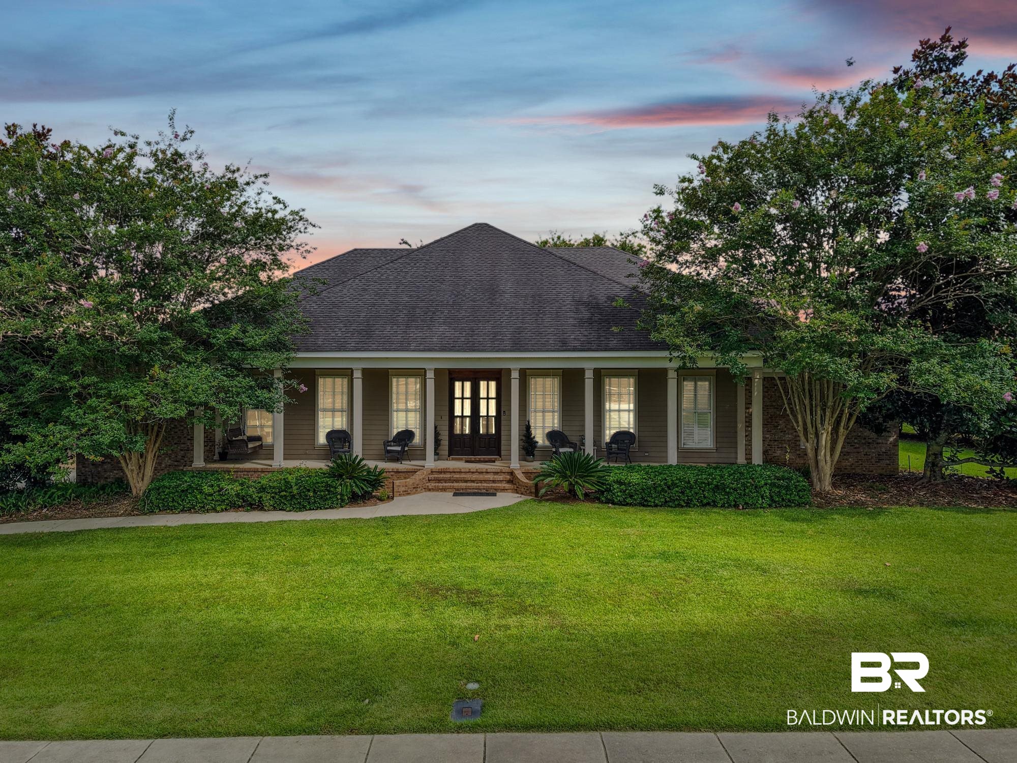 11261 Halcyon Loop Daphne, AL 36526 - Photo 2 of 41 Front exterior featuring a covered porch with white columns, a dark double-door entry, and a symmetrical facade