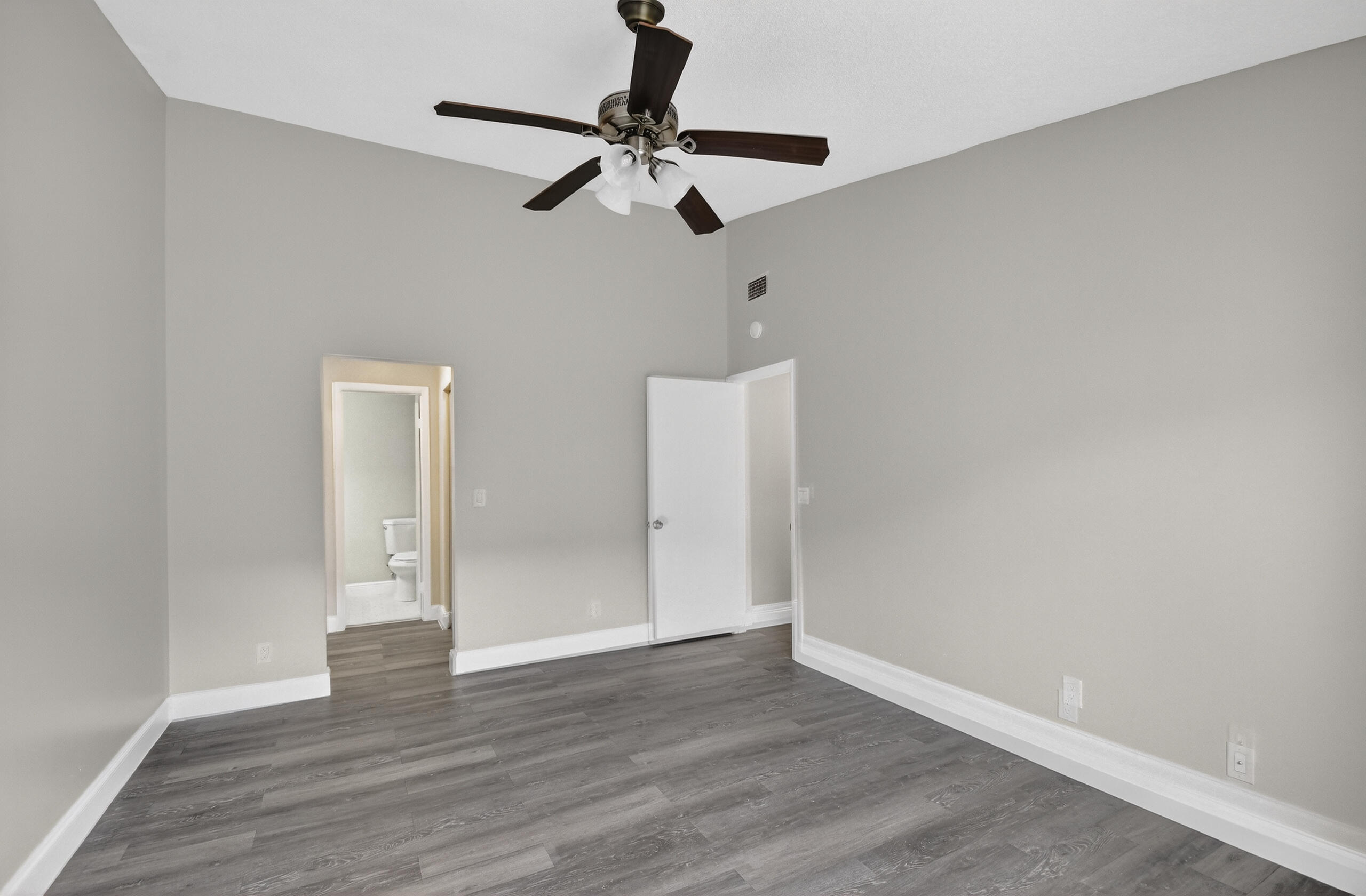 484 Springdale Circle, Unit 48D Palm Springs, FL 33461 - Photo 16 of 59 wooden floor in an empty room