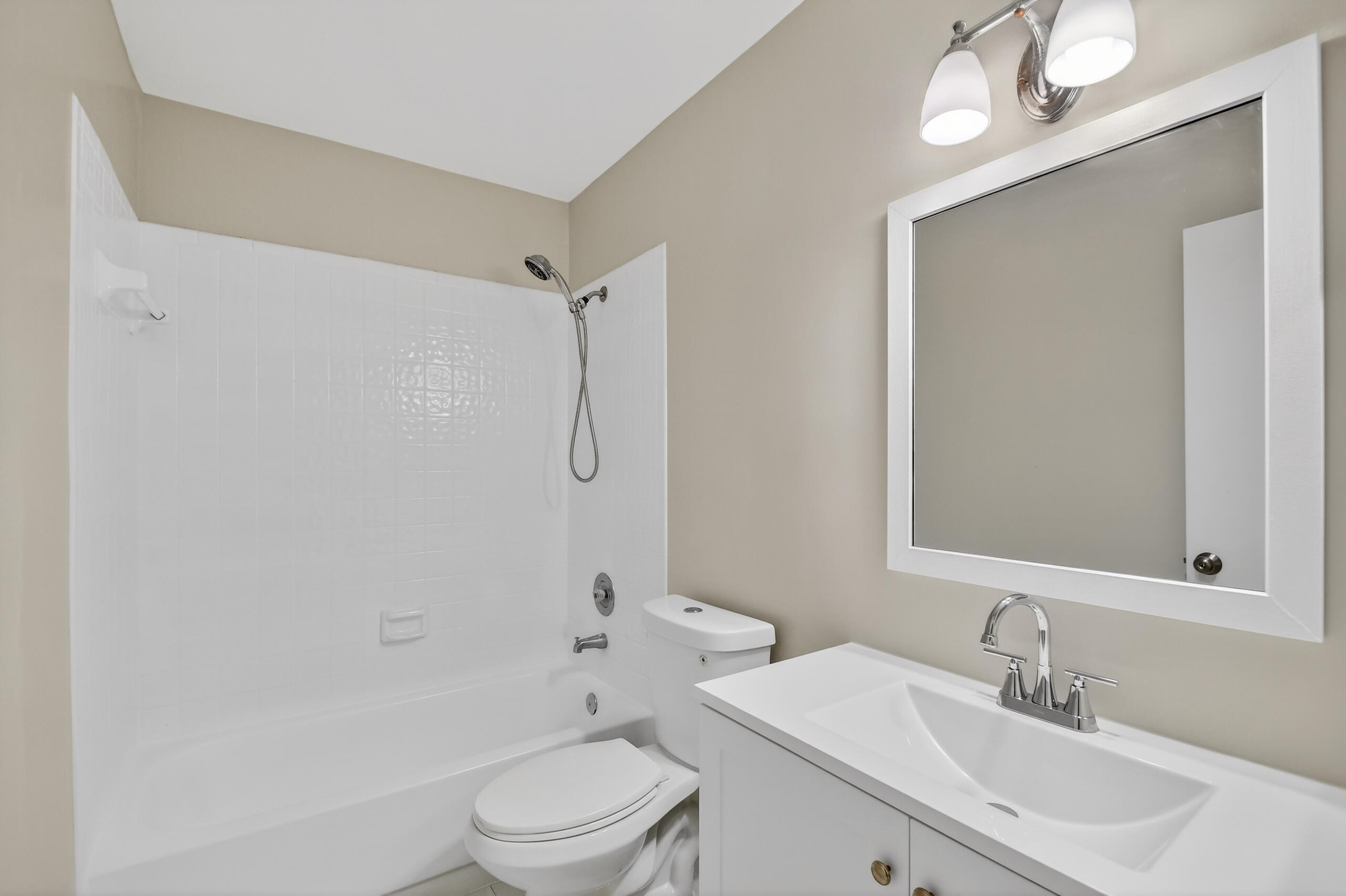 484 Springdale Circle, Unit 48D Palm Springs, FL 33461 - Photo 33 of 59 a bathroom with a sink a toilet and shower