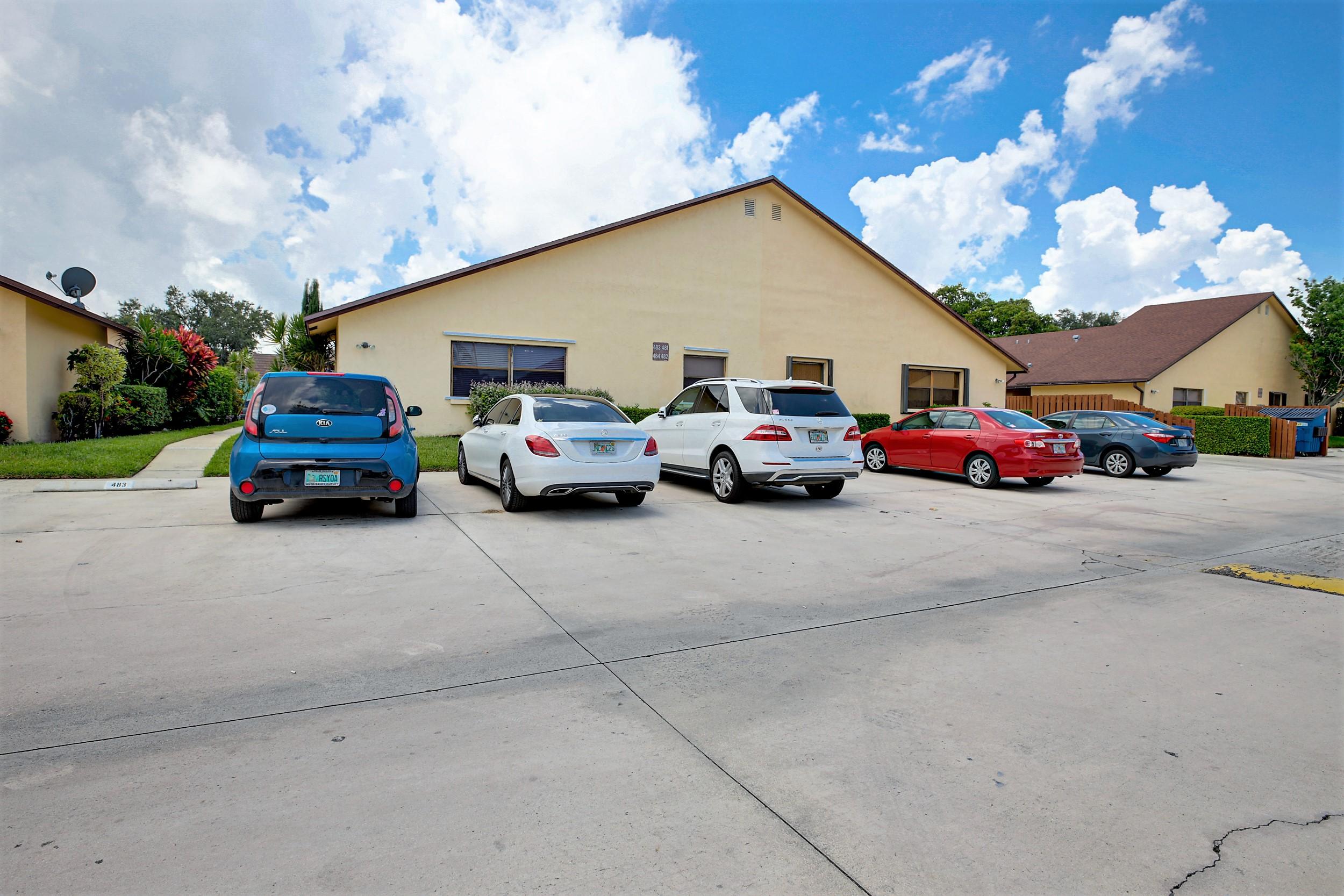 484 Springdale Circle, Unit 48D Palm Springs, FL 33461 - Photo 39 of 59 a car parked in front of a house