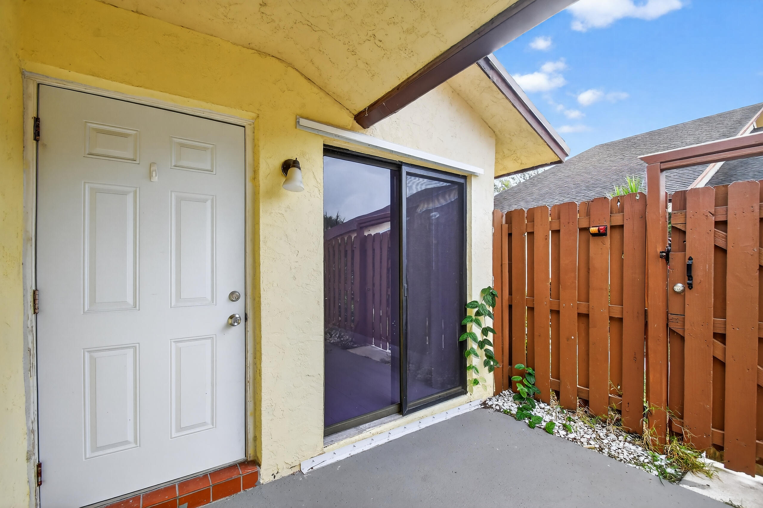484 Springdale Circle, Unit 48D Palm Springs, FL 33461 - Photo 42 of 59 a view of a hallway with wooden walls