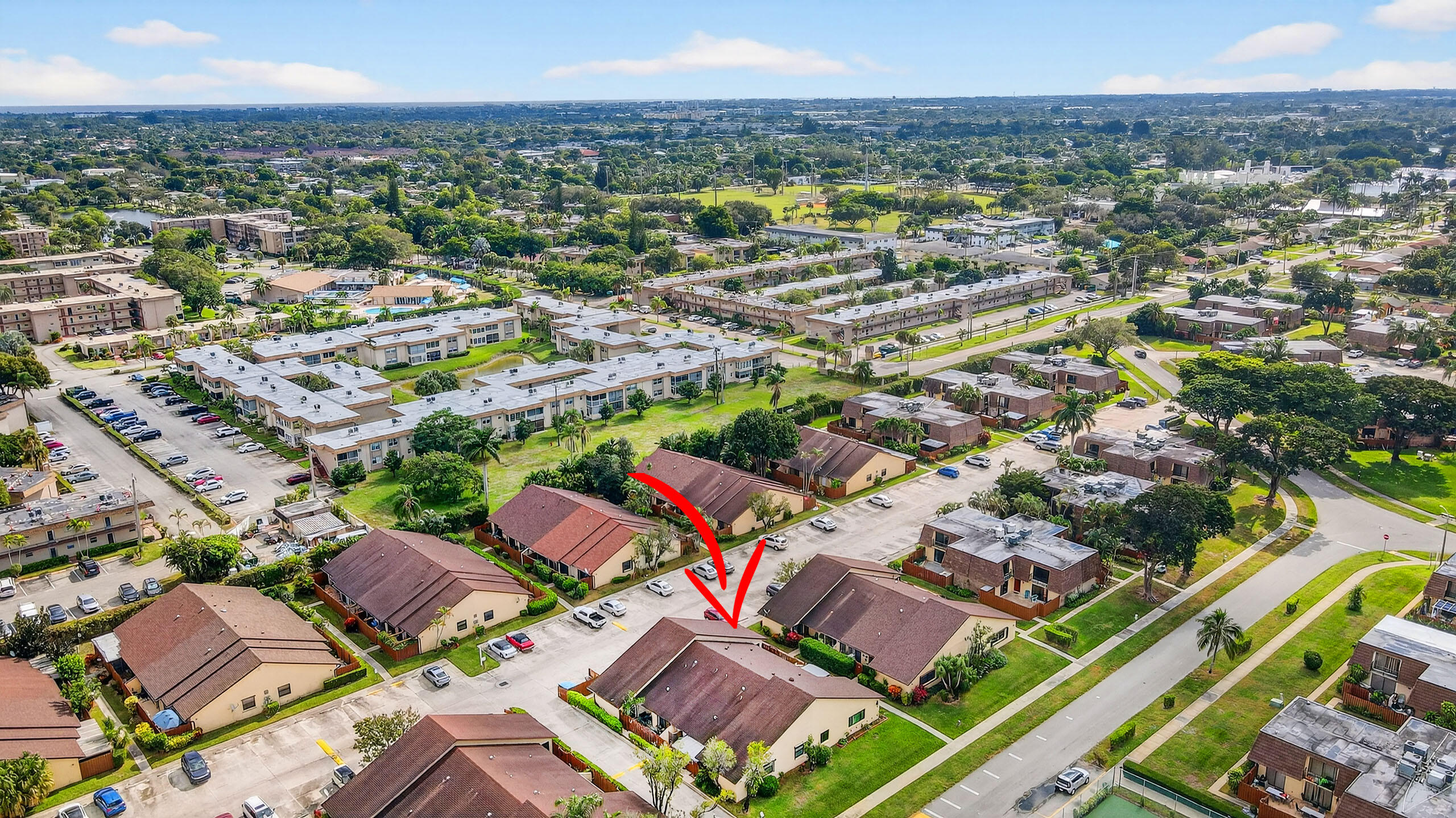 484 Springdale Circle, Unit 48D Palm Springs, FL 33461 - Photo 48 of 59 an aerial view of residential houses with outdoor space