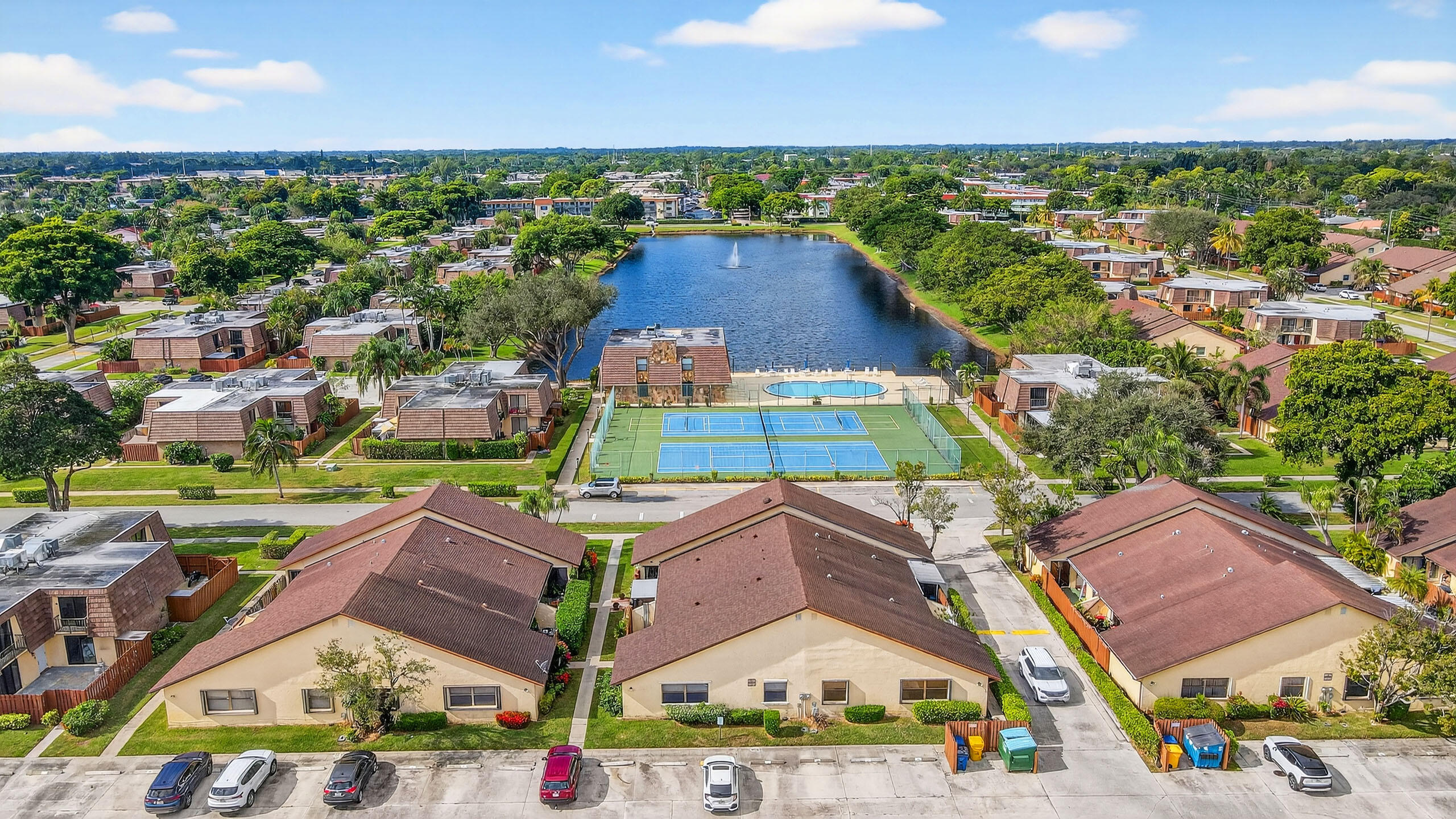 484 Springdale Circle, Unit 48D Palm Springs, FL 33461 - Photo 52 of 59 an aerial view of residential houses with outdoor space and street view