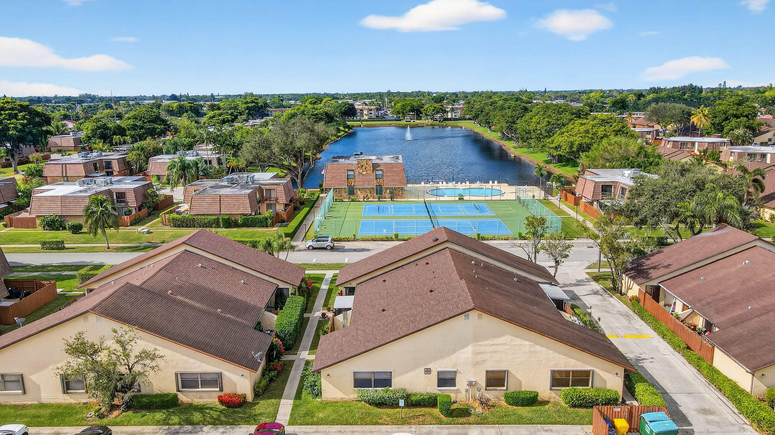 484 Springdale Circle, Unit 48D Palm Springs, FL 33461 - Photo 53 of 59 a aerial view of a house with a yard