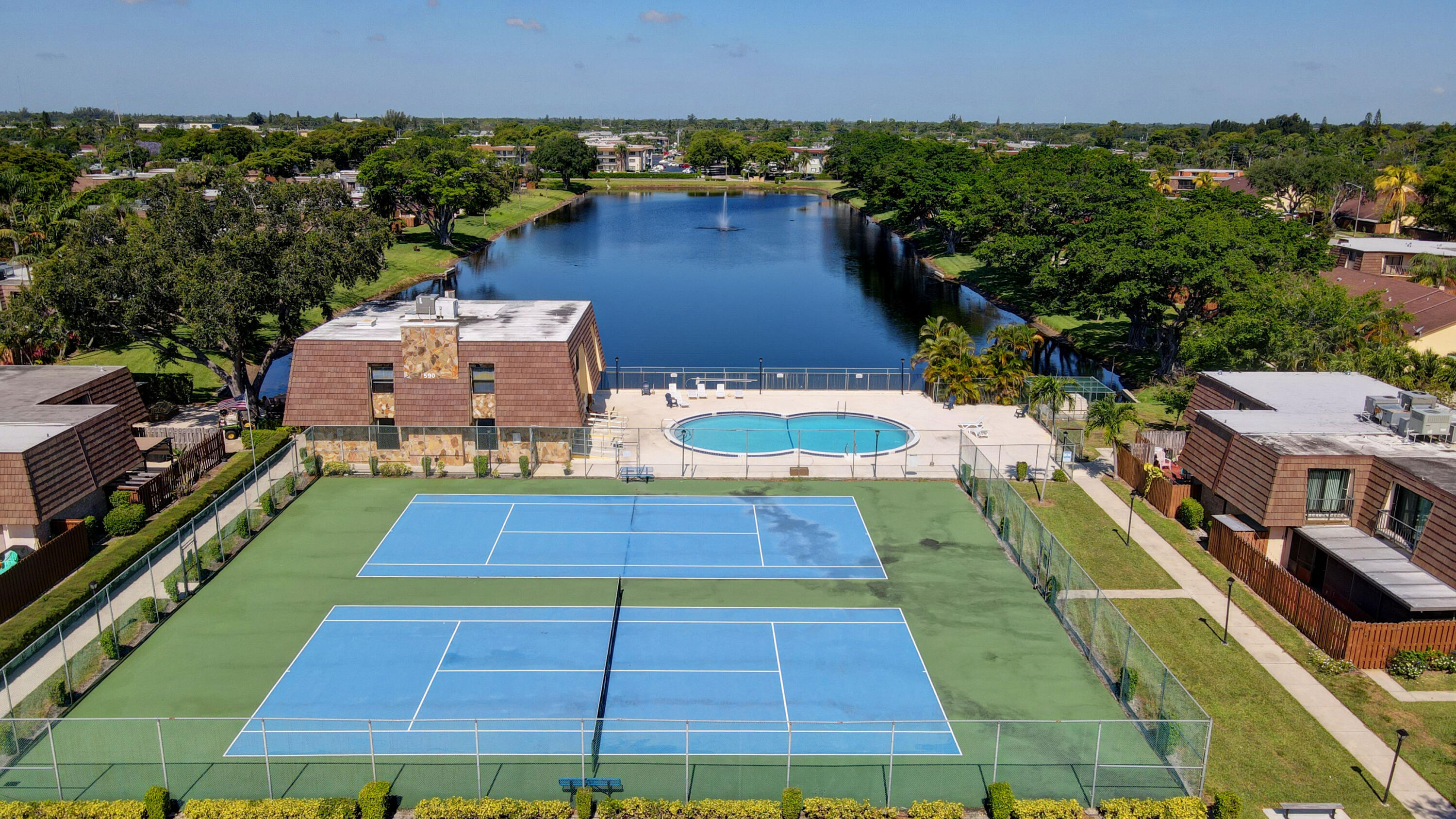 484 Springdale Circle, Unit 48D Palm Springs, FL 33461 - Photo 55 of 59 a view of a tennis court