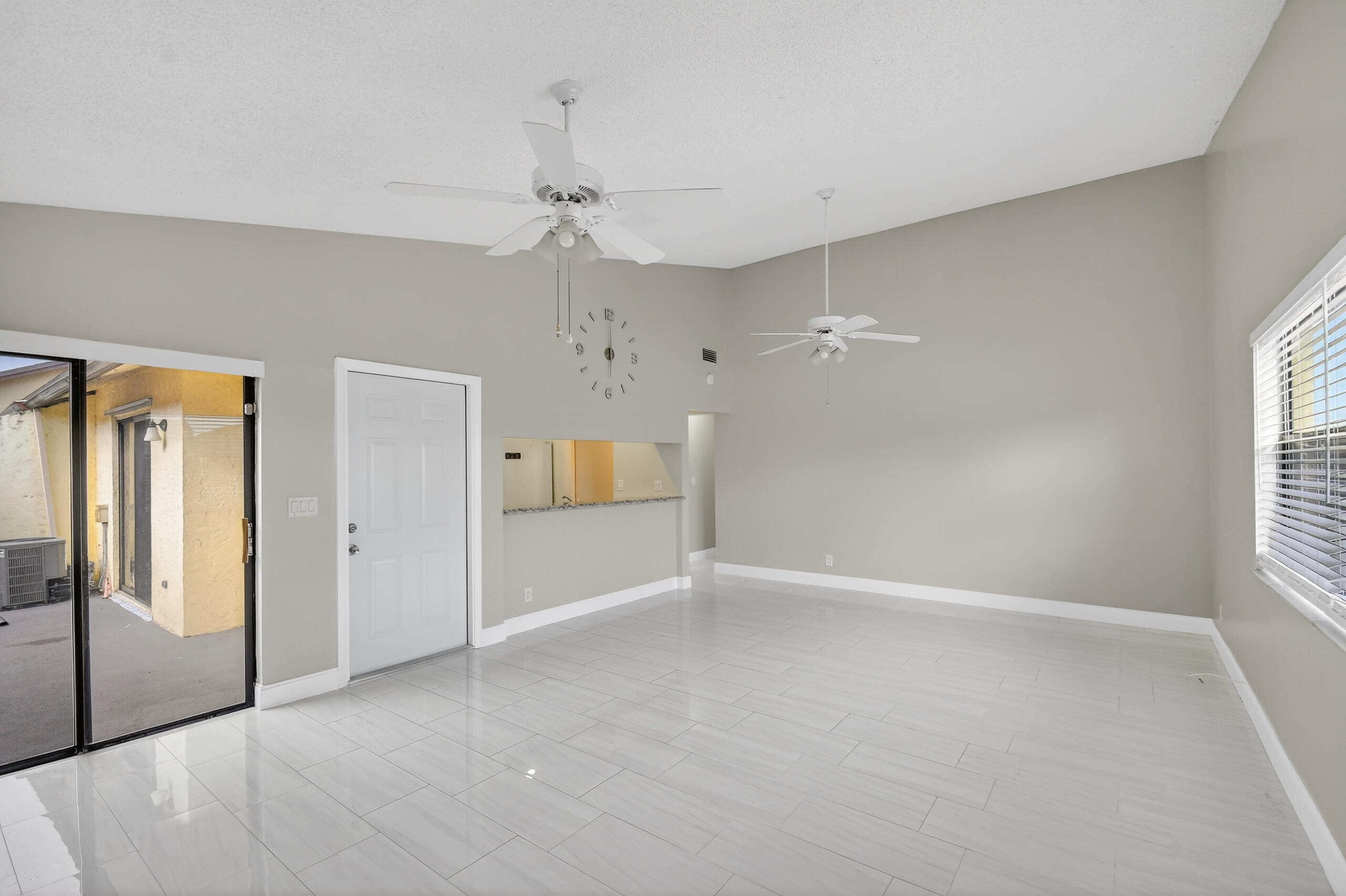 484 Springdale Circle, Unit 48D Palm Springs, FL 33461 - Photo 9 of 59 a view of an empty room with a window