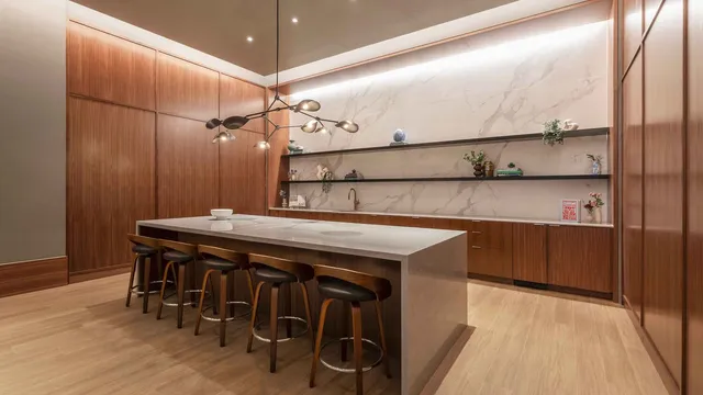 a kitchen with a table and chairs