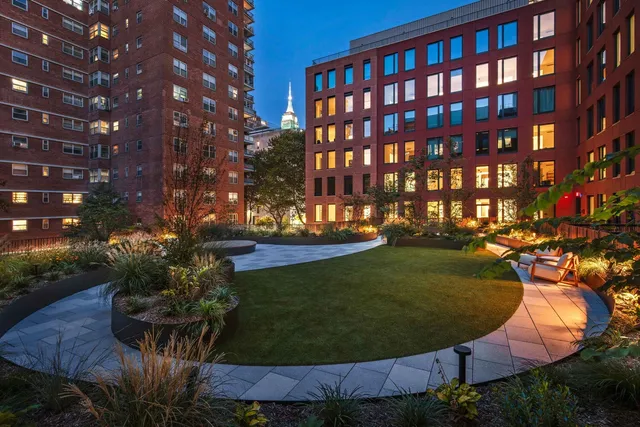 a view of a swimming pool with outdoor seating