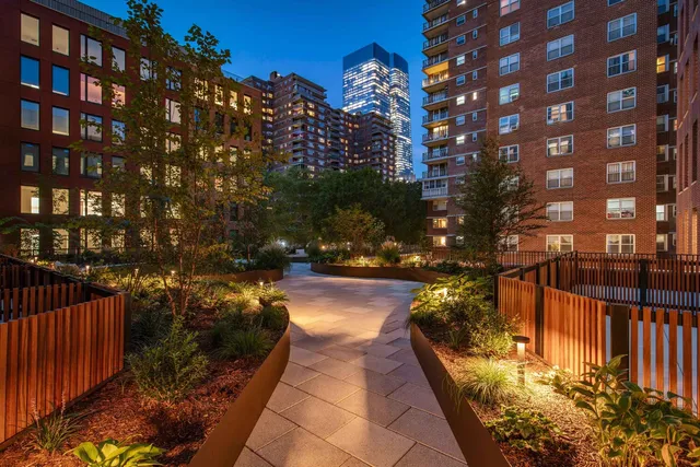 a view of a pathway with a yard