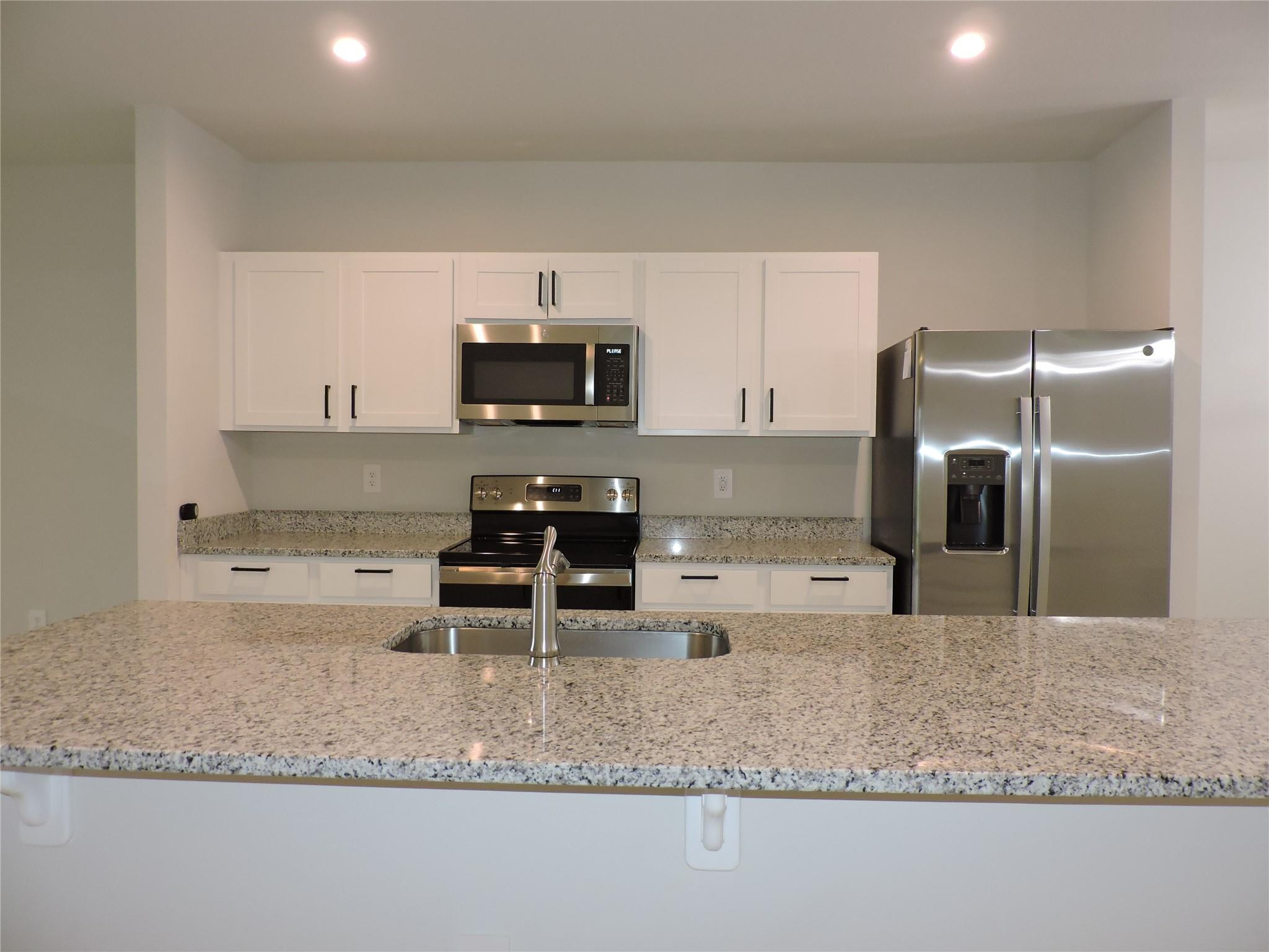 836 Persimmon Place Fort Pierce, FL 34981 - Photo 12 of 78 KITCHEN ISLAND WITH GRANITE COUNTER TOPS