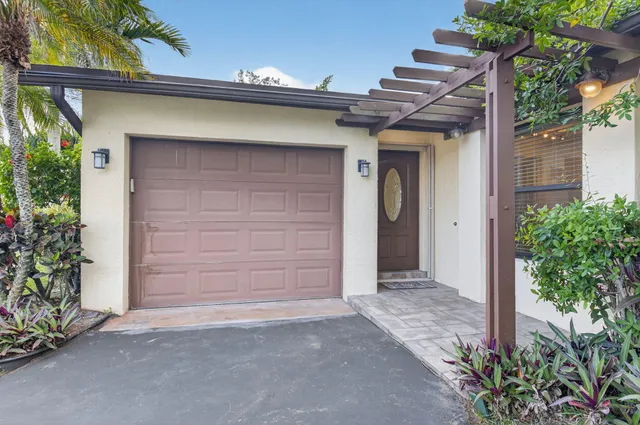a front view of a house with a garage