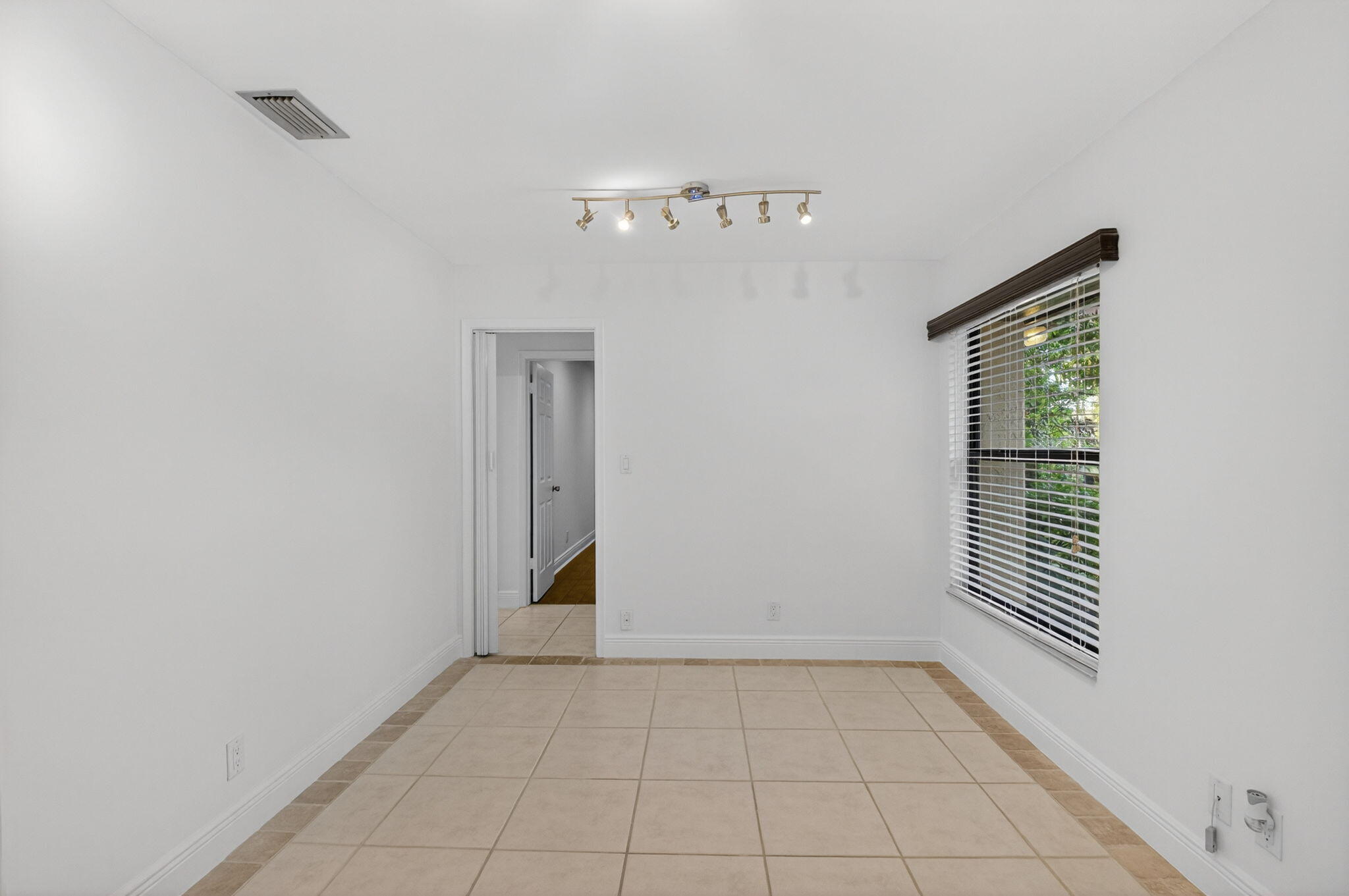 18051 104th Terrace South Boca Raton, FL 33498 - Photo 21 of 46 a view of an empty room with a window