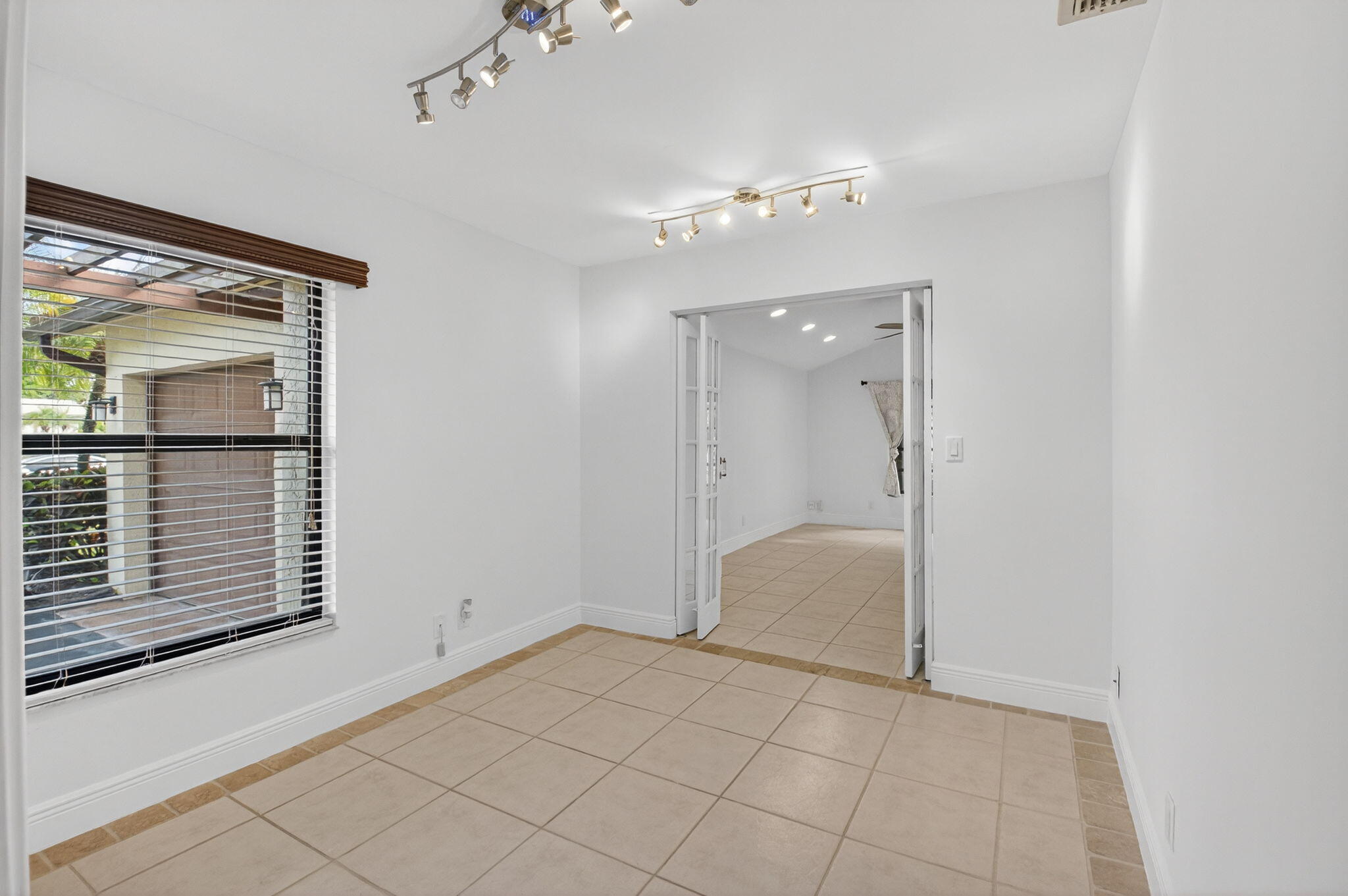 18051 104th Terrace South Boca Raton, FL 33498 - Photo 22 of 46 a view of an empty room with a mirror