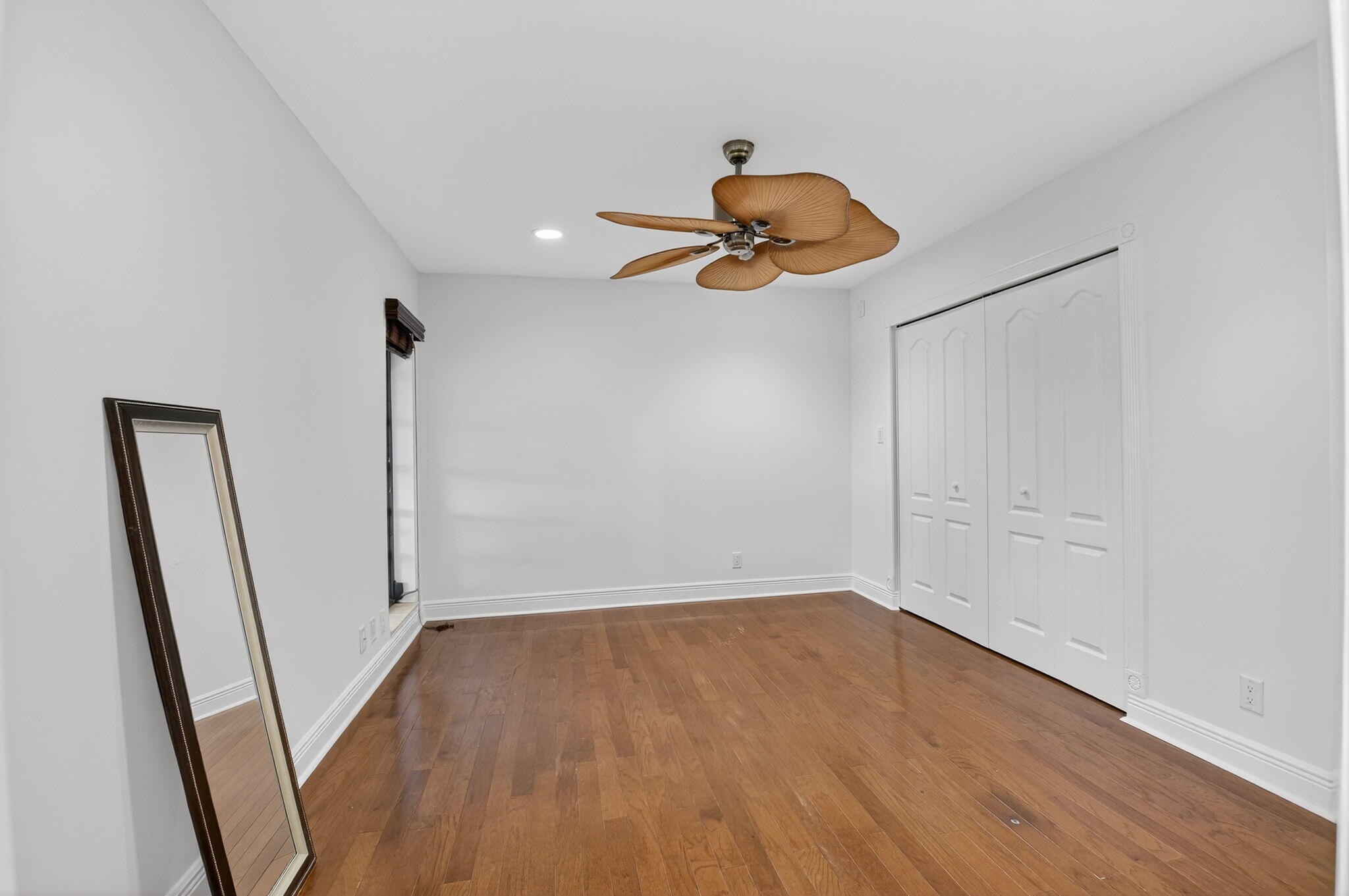 18051 104th Terrace South Boca Raton, FL 33498 - Photo 27 of 46 a view of an empty room with wooden floor