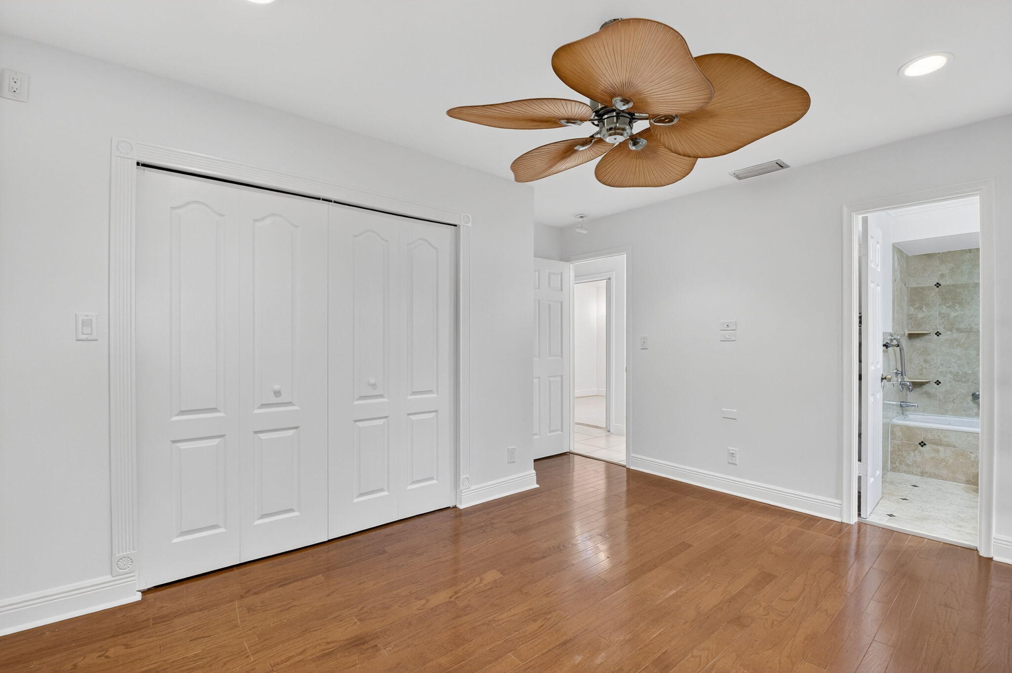 18051 104th Terrace South Boca Raton, FL 33498 - Photo 28 of 46 an empty room with wooden floor and cabinet
