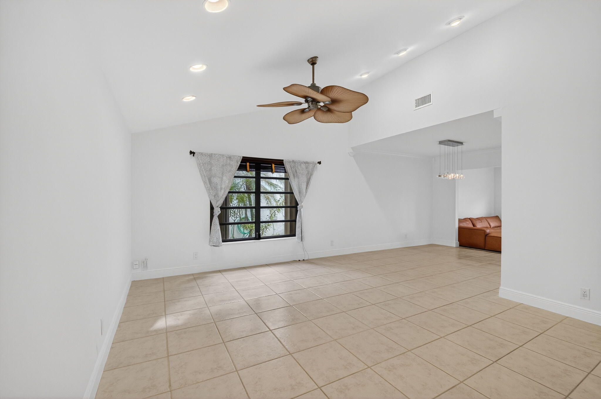 18051 104th Terrace South Boca Raton, FL 33498 - Photo 5 of 46 a view of a room with a ceiling fan and window