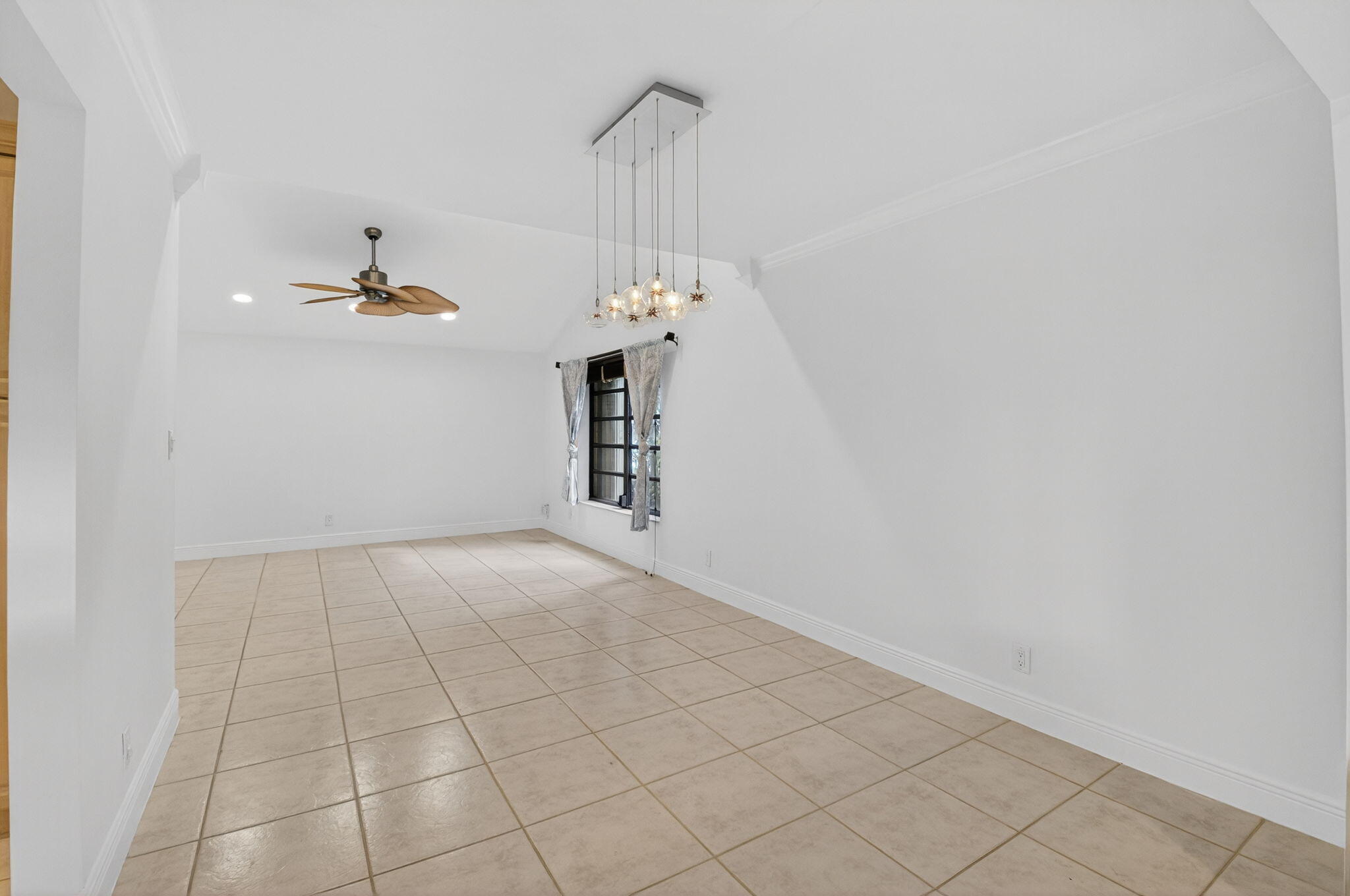 18051 104th Terrace South Boca Raton, FL 33498 - Photo 10 of 46 a view of a chandelier in an empty room