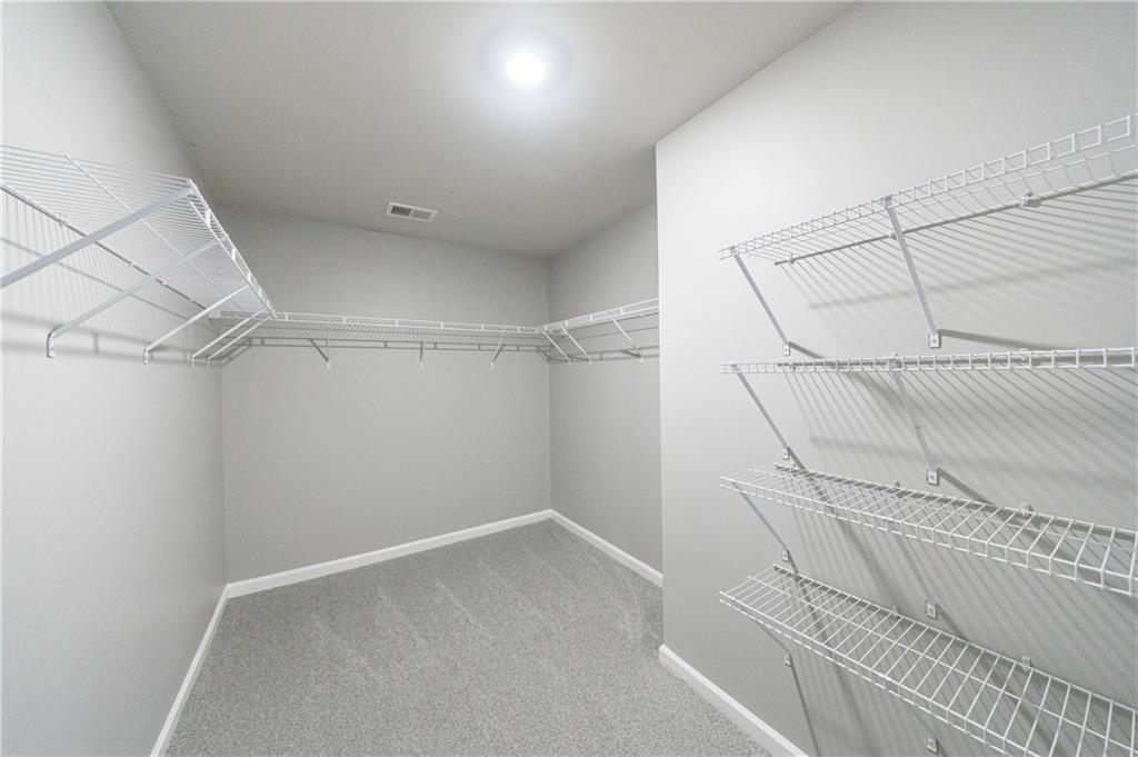 3413 Endurance Court Atlanta, GA 30349 - Photo 37 of 44 a view of a room with racks on the wall