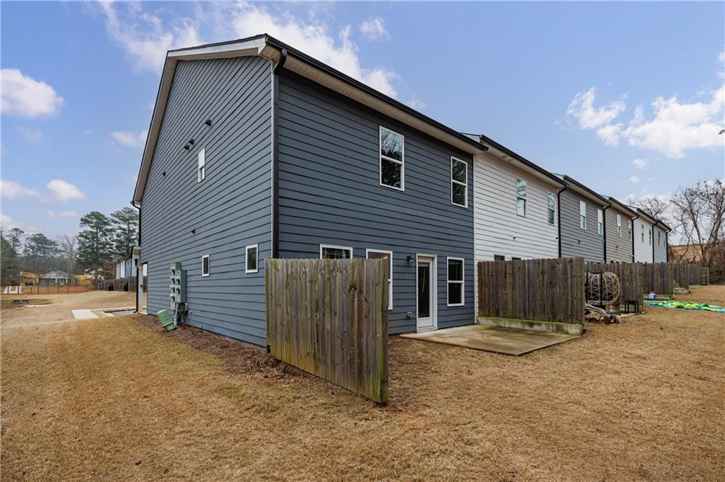3413 Endurance Court Atlanta, GA 30349 - Photo 4 of 44 a view of a house with a outdoor space