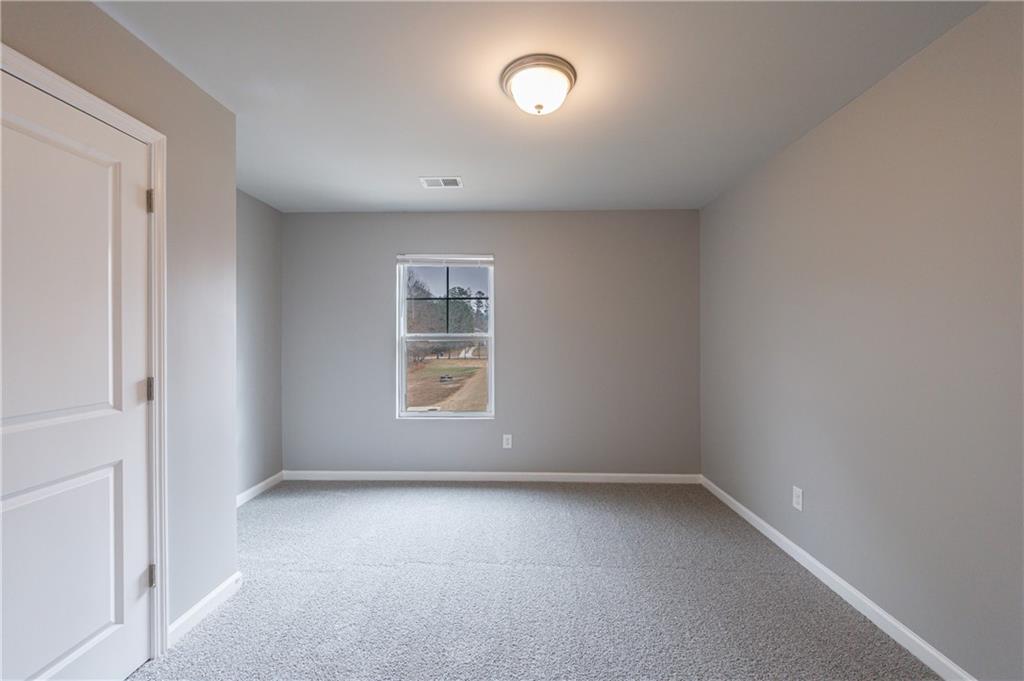 3413 Endurance Court Atlanta, GA 30349 - Photo 42 of 44 an empty room with a window