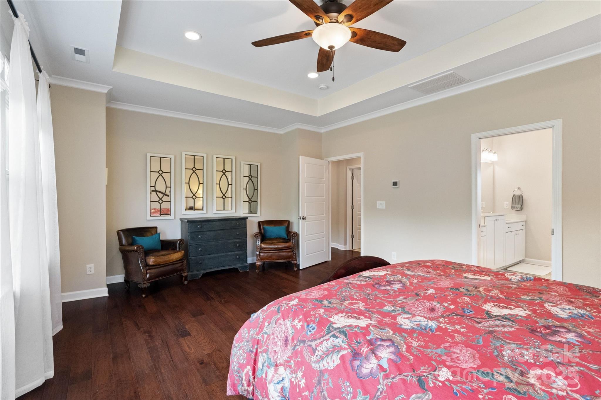 5301 Meadowcroft Way Fort Mill, SC 29708 - Photo 34 of 48 a bedroom with a bed and a chandelier