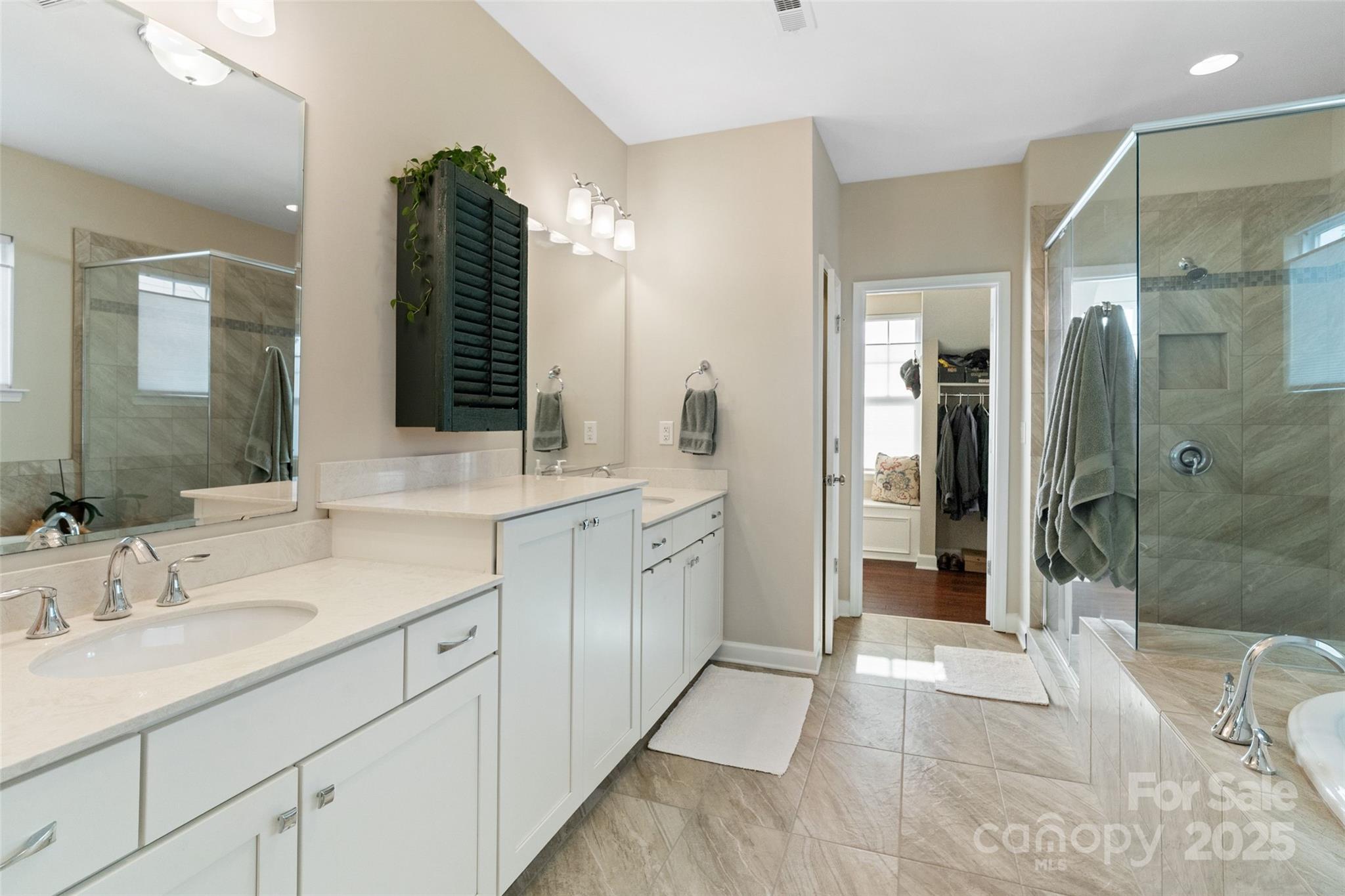 5301 Meadowcroft Way Fort Mill, SC 29708 - Photo 35 of 48 a spacious bathroom with a shower sink and mirror