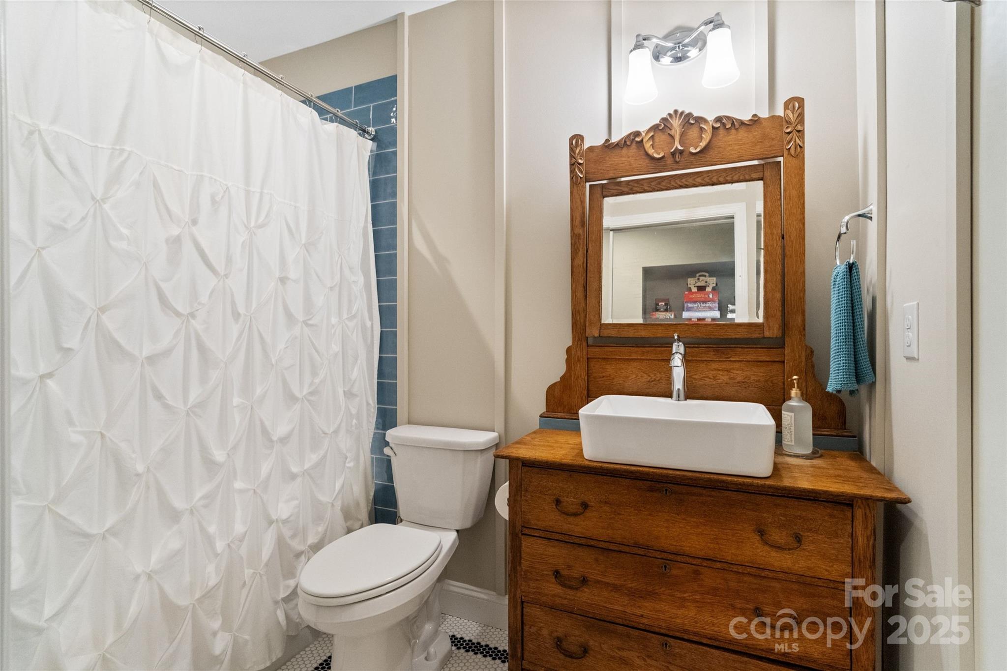 5301 Meadowcroft Way Fort Mill, SC 29708 - Photo 43 of 48 a bathroom with a toilet a sink and mirror