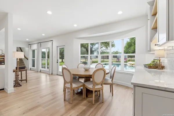 a dining room with furniture window wooden floor