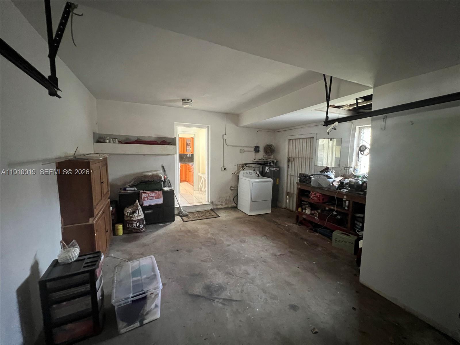 6200 Southwest 19th Street Miramar, FL 33023 - Photo 17 of 66 The uncovered garage offers the potential to be converted into an additional private space and already includes its own private entrance. Washer and dryer connections are in place with an active water line.