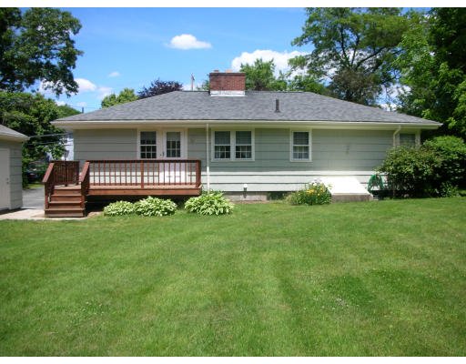 281 North Road Sudbury, MA 01776 - Photo 2 of 12 a front view of a house with a garden