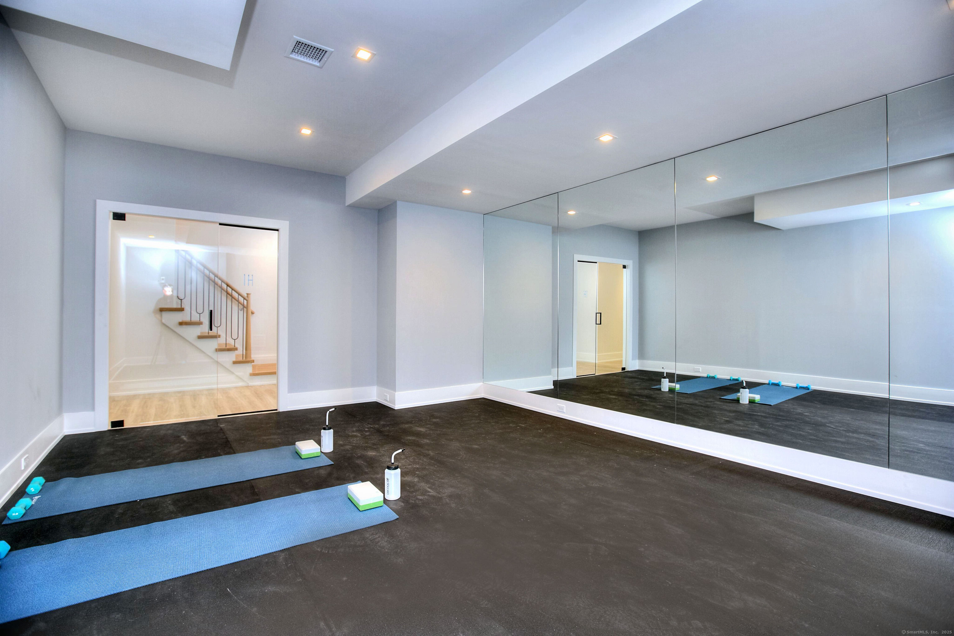 2 Webb Road Westport, CT 06880 - Photo 20 of 25 Lower Level with Gym, Play Room, Bedroom, Full Bathroom, Bar, Storage and Walk Out to Yard/Pool