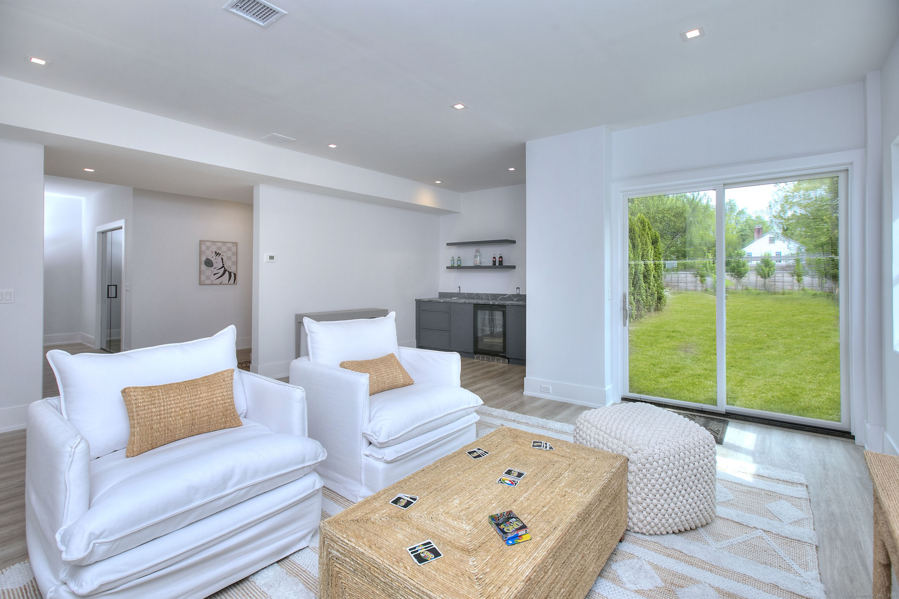 2 Webb Road Westport, CT 06880 - Photo 21 of 25 Family Room in Lower Level with Bar and doors to Yard/Pool