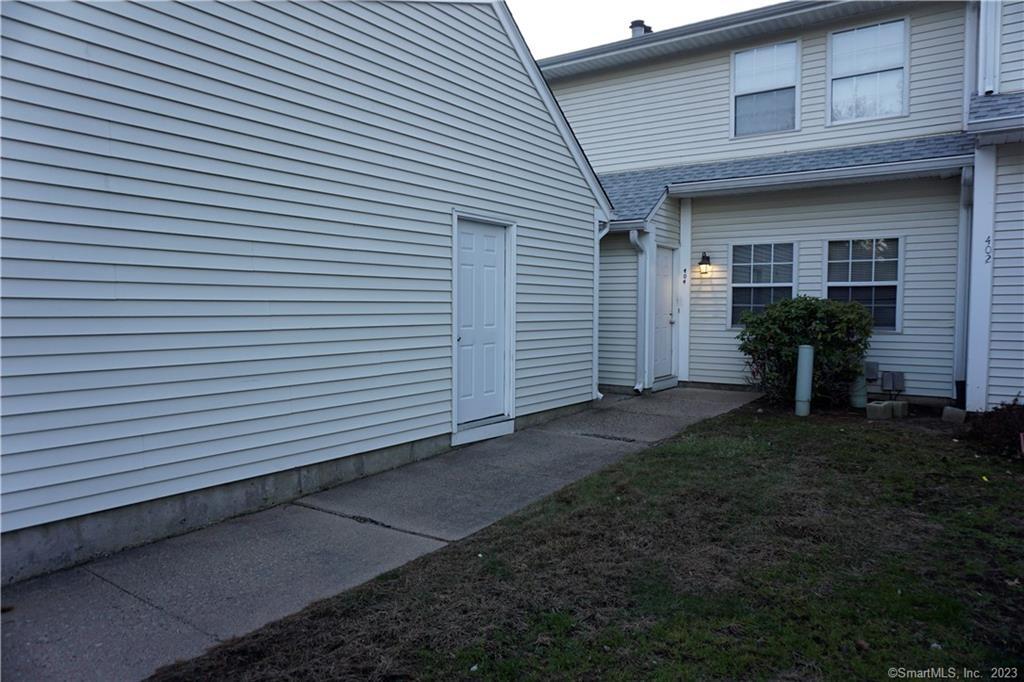 Exterior Front and Door into Garage