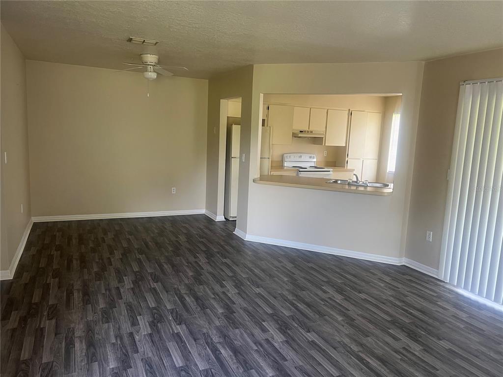 7266 Pond Circle Spring Hill, FL 34606 - Photo 3 of 15 a view of a kitchen from the hallway