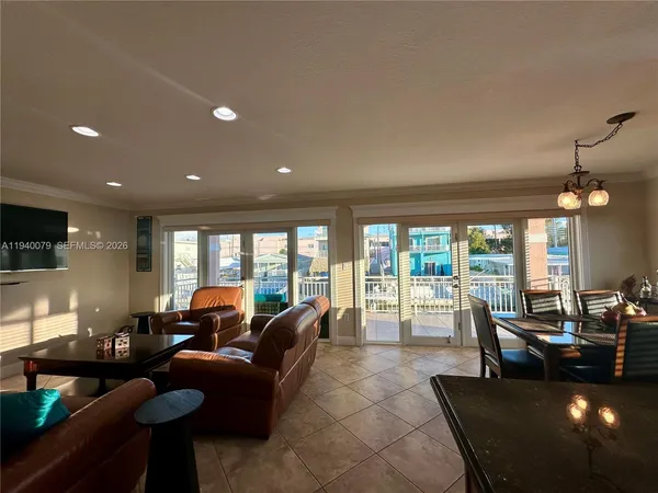 a large kitchen with a table and chairs